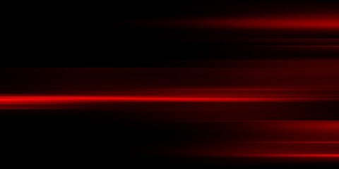 The effect of red light in fast motion on a black background. blurred abstract background with long exposure. neon light
