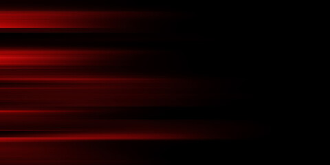 The effect of red light in fast motion on a black background. blurred abstract background with long exposure. neon light
