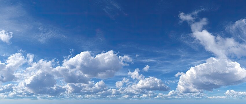 Wide shot of a vibrant blue sky filled with fluffy white cumulus clouds (1) - Powered by Adobe