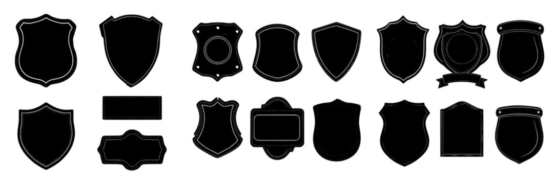 A collection of vintage-style badge templates, including black patch silhouettes, police badges, shields, and labels, all isolated on a white background
