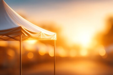A beautifully lit outdoor tent setting capturing the warm ambiance of a sunset, perfect for gatherings and events.