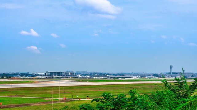 Chengdu Shuangliu International Airport Runway View with Aircraft and Terminal Buildings Under Blue Sky