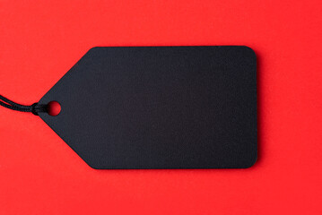 Empty black tag on red background.