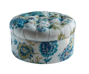 Round upholstered ottoman with blue and green floral pattern, tufted top, isolated on transparent background