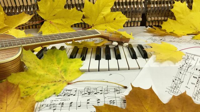 Acoustic Autumn Duet: A beautiful wooden ukulele rests on the keys of an old upright piano, surrounded by golden maple leaves and handwritten sheet music, creating a warm and nostalgic atmosphere