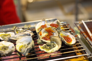 Grilled Oysters with Chili Sauce at Asian Street Food Market
