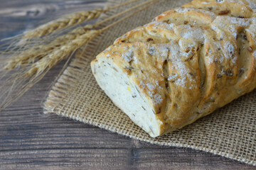 Freshly Baked Artisan Bread with Grains and Seeds on Burlap texture