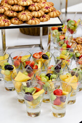 Buffet catering with assorted sandwiches on trays, party finger food and appetizers on a white table at corporate event
Catering buffet with assorted sandwiches on serving trays at event