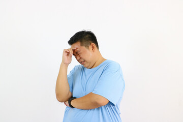 Man with headache holding head stressed and in pain isolated on white