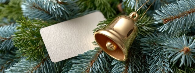 Golden bell ornament hanging on evergreen branches with a blank tag for personalization during the holiday season