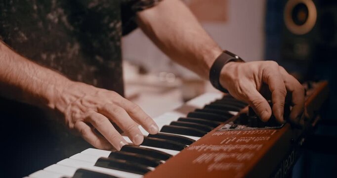 Professional musician plays instruments in the studio, sound recording process