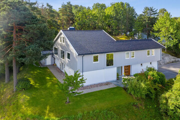 Modern villa exterior in minimal scandinavian style, 3d rendering