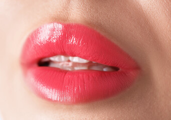 Obraz premium Woman with beautiful lipstick on her lips, macro view