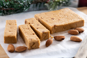 Christmas soft almond nougat bar on wooden table