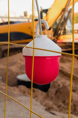 Red light hanging from a fence