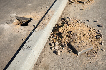 Rectangular hole in the asphalt for installing a fence support