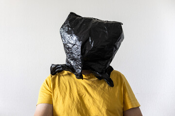 black plastic bag wraps around a human head