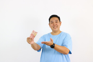 Excited asian Man Holding Money on isolated white background