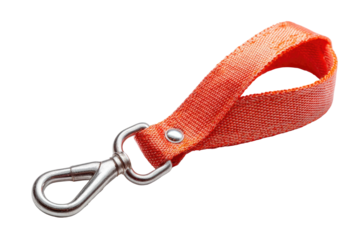 Close-up of a vibrant orange textile loop with a silver-colored metal hook against a black background