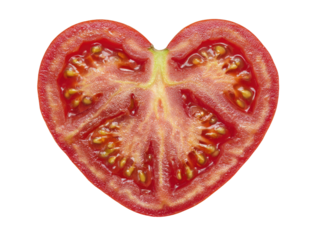 Close-up of a heart-shaped tomato slice, cut open to reveal seeds and juicy flesh