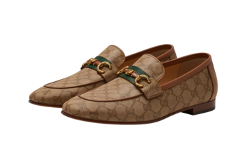 Pair of tan monogram loafers with green stripe and gold buckle isolated on a transparent background
