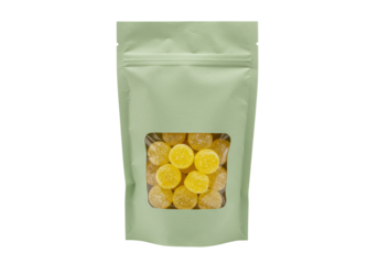 Yellow gummy drops in a green pouch isolated on transparent background, sweet candy treat for kids and adults