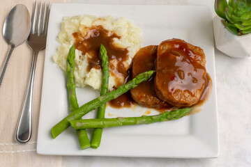 salisbury steak  with  asparagus and mushpotatoes