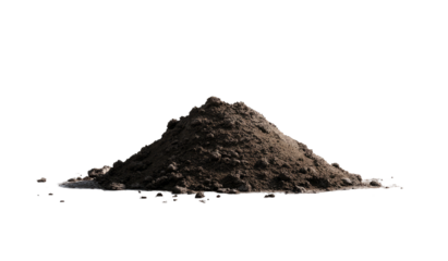 A small pile of dark soil sits isolated against a black background, showcasing the earthy texture