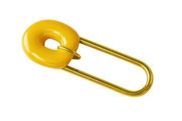A bright yellow safety pin with a round, yellow-plastic head, on a stark black background