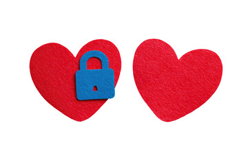 Two red heart shapes, one with a blue lock on, isolated against a black background