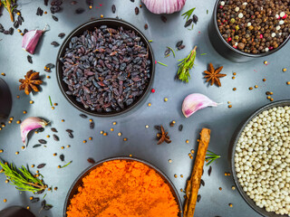 Bright spices and herbs arranged beautifully on a kitchen countertop for flavorful cooking exploration in a home setting