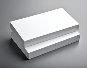 Stack of White Paper Sheets on Gray Background Under Soft Lighting Presentation Pile of Rectangular Papers