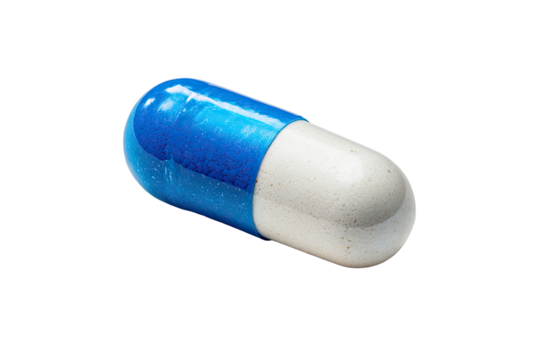 Isolated macro shot of a blue and white pharmaceutical capsule with a soft shadow on a black background