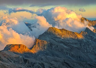 Monte Rosa (Italy) - A mountains view in Valsesia with Monte Rosa mount peak of Alps, alpinistic paths to Rifugio Modena and Capanna Margherita refuge, with snow glacier and alpinists.