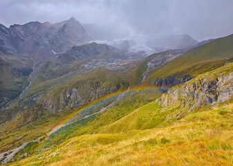 Monte Rosa (Italy) - A mountains view in Valsesia with Monte Rosa mount peak of Alps, alpinistic paths to Rifugio Modena and Capanna Margherita refuge, with snow glacier and alpinists.