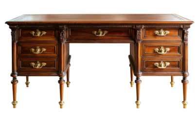 Elegant antique wooden desk with multiple drawers and ornate brass handles, isolated on white.