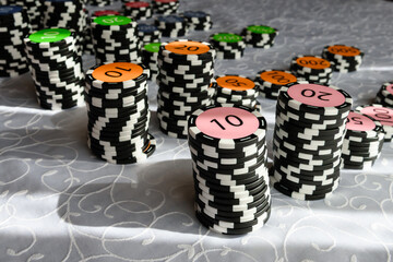 Casino chips on the table. Coins for board games.