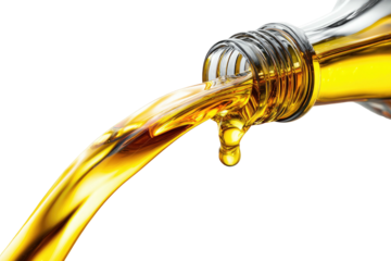 A close-up of a transparent bottle pouring a stream of golden liquid with a black background