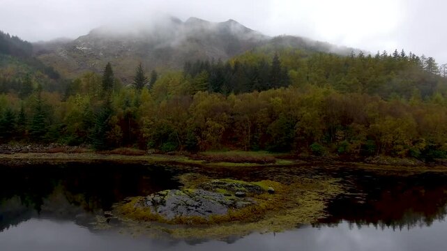 Aerial drone view of Loch Leven in Scotland on a moody misty day