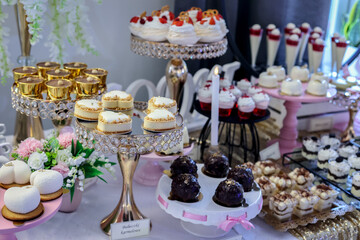 Dessert buffet or candy bar during catering event, fruits and whipped cream
