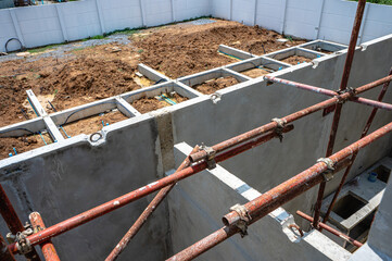 Cement beams on ground for housing foundation construction