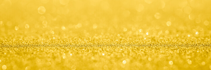 Abstract gold glitter sparkle texture with bokeh background