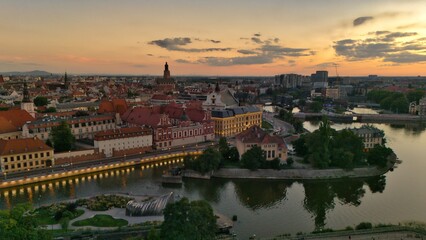 Evening Panorama of Wrocław – Aerial View with Illuminated Street Lamps