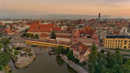 Evening Panorama of Wrocław – Aerial View with Illuminated Street Lamps
