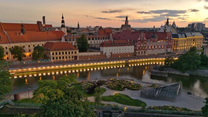 Evening Panorama of Wrocław – Aerial View with Illuminated Street Lamps