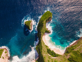 Aerial drone view of rocky tropical beach island at Kelingking Beach, Nusa Penida., perfect summer seascape for travel and nature