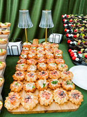 Assorted Gourmet Mini Quiches and Canaps Display at a Festive Event