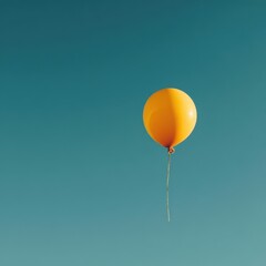 Single Yellow Balloon Floating Against Clear Blue Sky