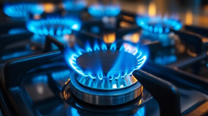 The blue flame of a gas stove in a dark room is useful for illustrations about kitchen appliances and gas safety.