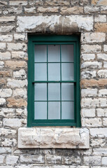 old window in a stone wall
